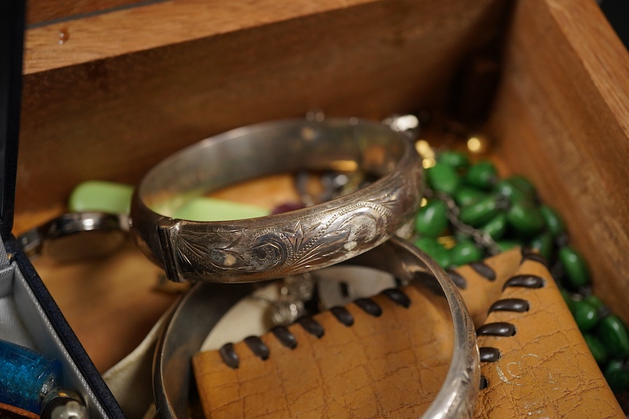 A small group of assorted mainly costume jewellery and wrist watches, including two silver hinged bangles, green enamel necklace and BMW quartz chronograph wrist watch.